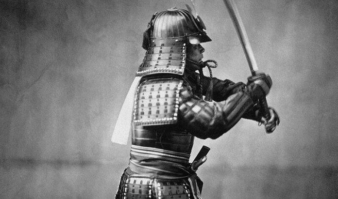 A studio photograph of a samurai, taken by Italian–British photographer Felice Beato