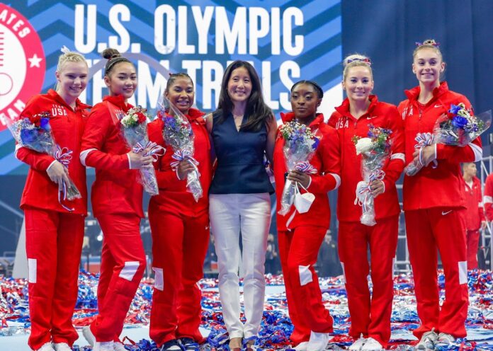 U.S. Olympians Jade Carey, Sunisa Lee, Jordan Childs, Simone Biles, MyKayla Skinner, and Grace McCallum pose with USAG President Li Li Leung at the U.S. Women's Gymnastics Olympic Team Trials in June 2021