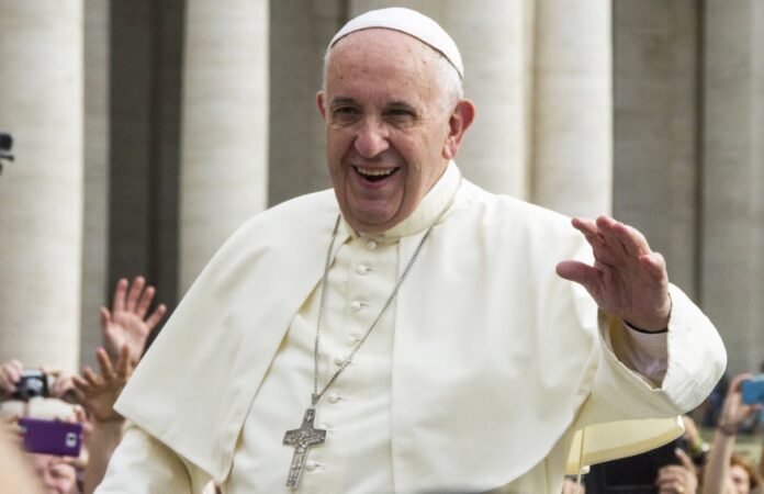 Pope Francis on the popemobile blesses the faithful in St. Peter's Square in Vatican City, Rome, Italy in 2015